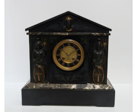 A French black slate mantle clock with movement by AD Mougin, retailed by D McMillan, Dingwall, the front of the clock applie