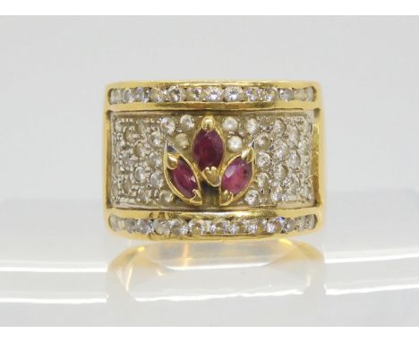 An Italian made 18ct gold clear gem and ruby wide band ring, size R1/2, weight 10.6gms Condition Report:Available upon reques