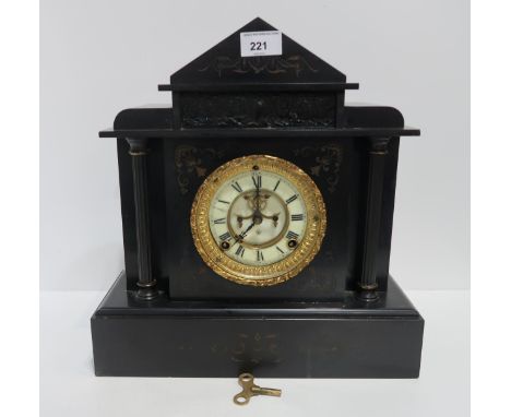 A Victorian black slate mantle clock, with Ansonia Clock Co movement sated 14 June 81 Condition Report:Has key and pendulum, 