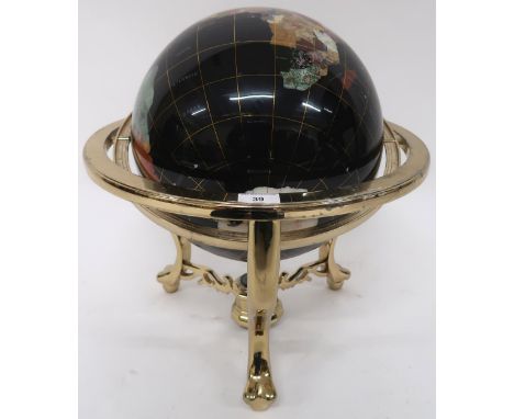A 20th century gemstone inset table top globe, 48cm high x 41cm diameter Condition Report:Available upon request