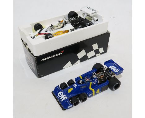 An Exoto Grand Prix Classics 1:18-scale Tyrell Ford P34, and a Minichamps McLaren Ford M23 Yardley J. Schecker 1973, both box