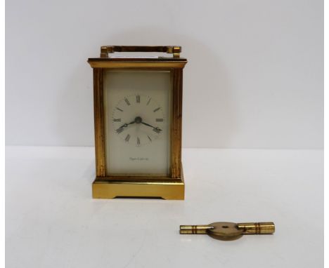 A Mappin and Webb brass and glass carriage clock, with key Condition Report:winds, needs a clean as nicotine covered