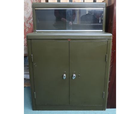 A mid 20th century Howden steel tool/stationary cabinet with pair of glazed sliding doors over pair of cabinet doors, 125cm h