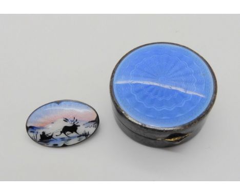 A Norwegian silver and enamel reindeer brooch, together with a silver guilloche enamel pillbox Condition Report:No condition 