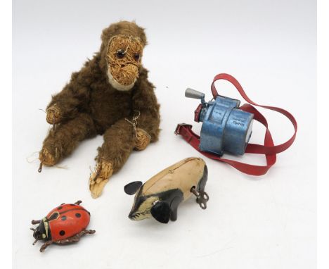 A tinplate clockwork walking pig, marked "Made in Gt. Britain" to underside, a German tinplate clockwork ladybird, early-C20t