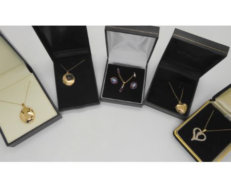 A collection 9ct gold to include three lockets, a diamond accent heart pendant, ruby pendant and earrings etc weight all toge