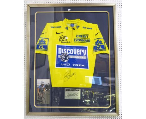 SPORTING MEMORABILIA A 2005 Tour de France leader's yellow jersey, signed by Lance Armstrong, framed under glass and measurin