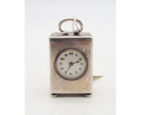 An Edwardian Swiss silver Valme Argent miniature carriage clock, with roman numerals and a dotted gilt band surrounding, with