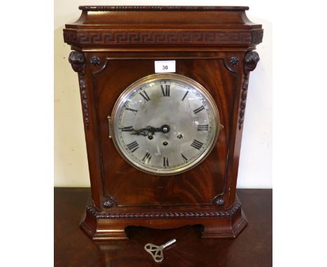 A 20th century mahogany cased mantle clock with Grecian key design over silvered dial bearing roman numerals, 49cm high x 38c