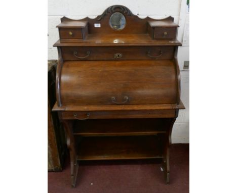 Oak roll fronted writing desk 