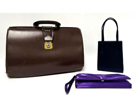 A gentleman's leather briefcase, 30 cm, and two ladies purses.