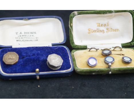 Silver cased button set and two others