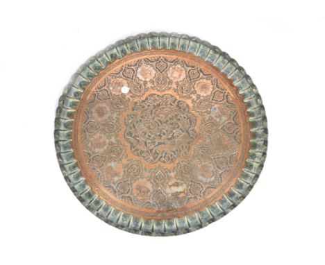 A copper tray, central panel decorated with deer and birds surrounded by panels depicting signs of the zodiac on an arabesque