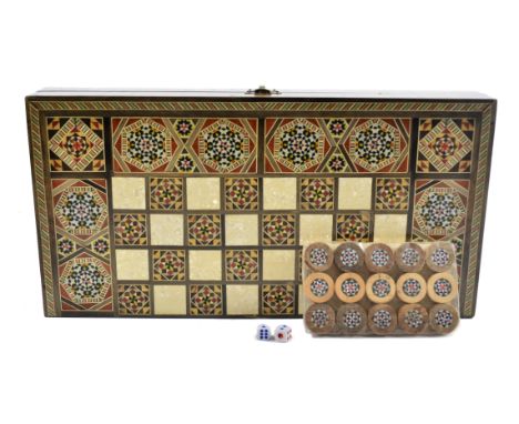 A 20th Century Middle-Eastern parquetry and mother-of-pearl inlaid chess board, external chess and internal backgammon, with 