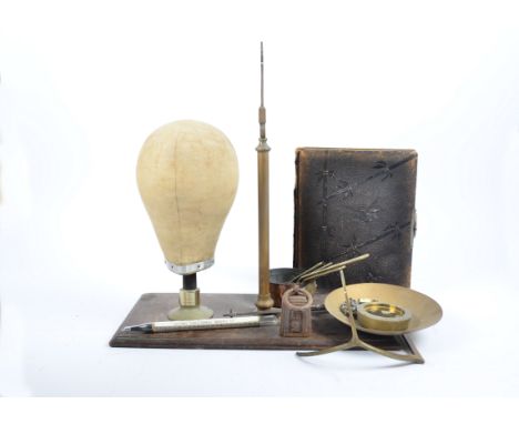 A vintage milliner's dummy head on stand, 34 cm high; together with a set of Parnall &amp; Sons brass balance scales; a set o