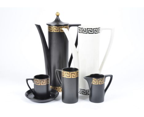 A Portmeirion 'Greek Key' pattern coffee set designed by Susan Williams Ellis, in black and gold, comprising, six coffee cans