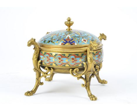 A 19th Century French champlevé enamel and brass lidded dish, decorated in a pattern of scrolling motifs and flowers, standin
