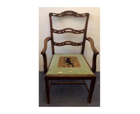 A Georgian style stained beech carver chair, ladder back, drop-in seat with heraldic lion