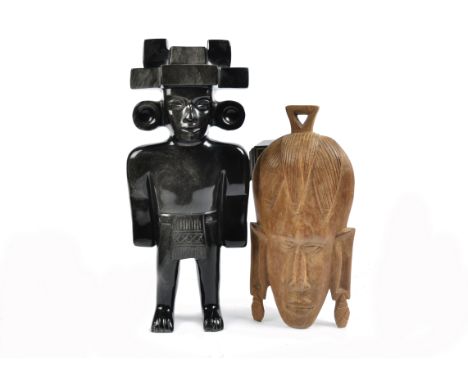A obsidian Mexican Mayan style figure, 34.5 cm tall; together with a modern African mask, 27 cm (2)