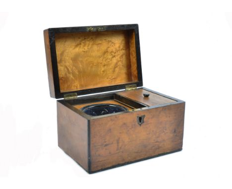 A 19th Century walnut and ebony strung tea caddy, brass escutcheon, hinged lid revealing glass mixing bowl and lidded compart