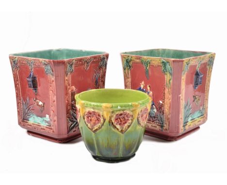 A pair of ceramic jardinieres, of a square form and decorated with scenes of figures and animals on alternating sides, turquo