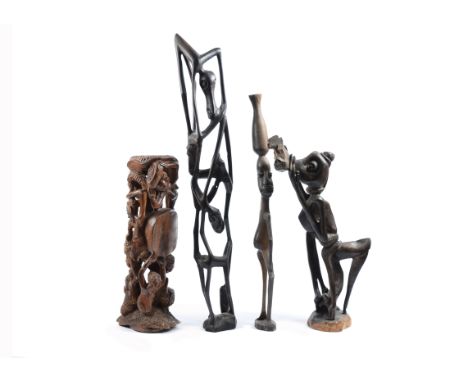 A collection of modern African items, comprising three Makonde style figures, a Nupe multi-spouted pot, an Ethiopian ceramic 