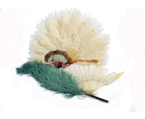 A 20th century feather fan, the monture and guards of mother of pearl, the body with yellow and white cockatoo feathers, guar