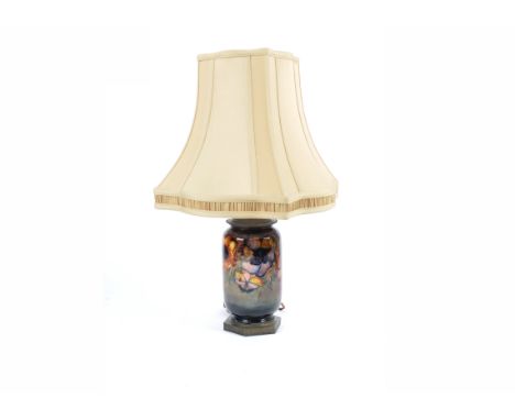 A 1930s Moorcroft table lamp, tubelined floral decoration, hexagonal metal base, with ivory Endon shade, 58 cm high with shad