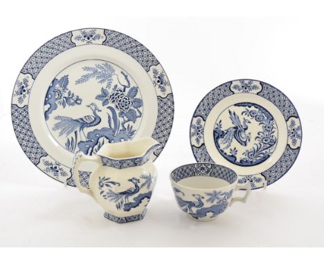 A Wood &amp; Sons 'Yuan' pattern part dinner service, decorated with a peacock in a landscape in blue and white, comprising e