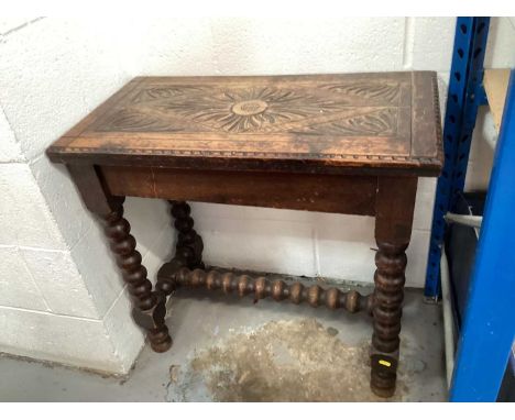 Late Victorian carved oak side table on bobbin turned legs joined by stretcher