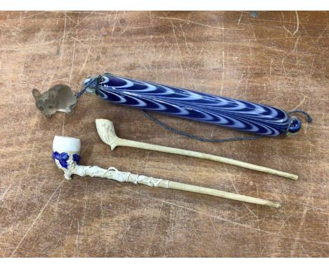 Small Nailsea glass rolling pin, tiny glass seated dog and two 19th century clay pipes