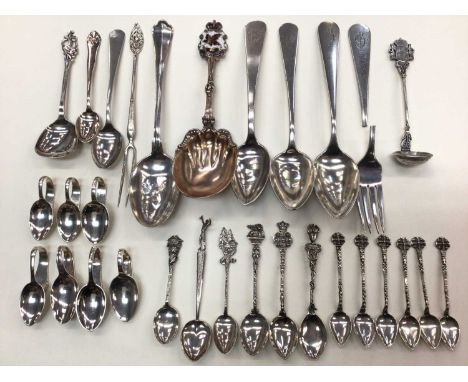 Group of Continental silver and white metal flatware including souvenir spoons, Canadian sterling silver and enamel serving s