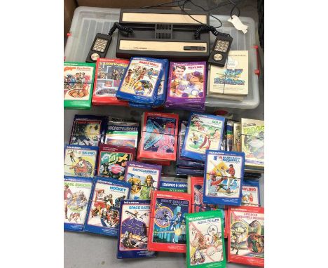 Mattel Electronics Intellivision intelligent television with controllers and a quantity of boxed games