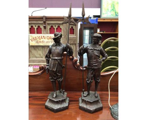A pair of bronzed figures of cavaliers, signed Winslow, 68cm highPlease note this lot no longer contains a lamp base.