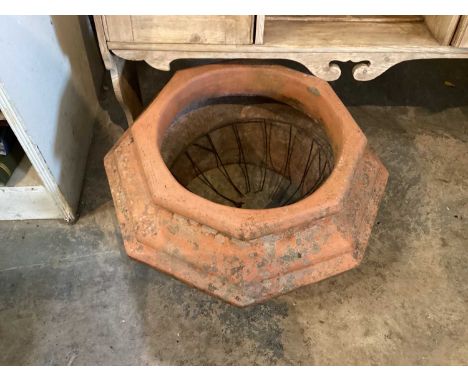 Terracotta planter together with a square chimney pot