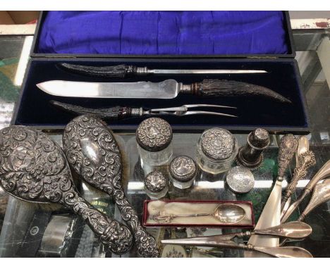 Silver backed brushes, silver topped glass jars, silver handled flatware, cased carving set and other items