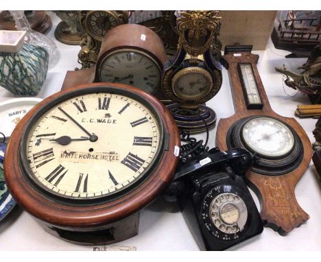 Various mantle clocks including a brass clock mount/frame, E. G. Wade wall clock with White Horse hotel label, wall barometer