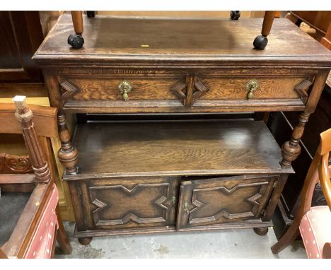 Late Victorian oak buffet with two drawers on turned supports with two geometric moulded panelled doors below, 107cm wide, 46
