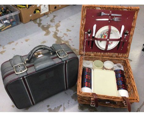 Vintage suitcase with Omega logo, together with a wicker picnic hamper