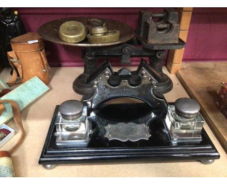 Decorative desk ink well stand, set of scales, two wooden mantle clocks, canteen of cutlery and sundries