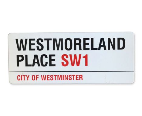 An enamelled iron street sign for Westmoreland Place SW1, City of Westminster with iconic black and red sans serif lettering 