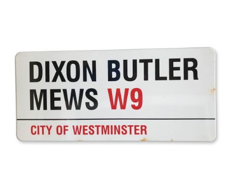An enamelled iron street sign for Dixon Butler Mews W9, City of Westminster with iconic black and red sans serif lettering fi