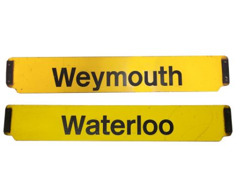 A double-sided enamel railway cab destination plate for Waterloo / Weymouth,black lettering on a yellow ground, metal tabs on