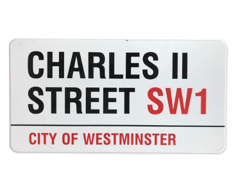 An enamelled iron street sign for Charles II Street SW1, City of Westminster with iconic black and red sans serif lettering f
