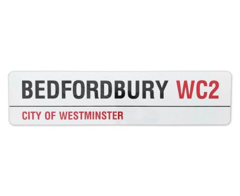 An enamelled iron street sign for Bedfordbury WC2, City of Westminster with iconic black and red sans serif lettering first c