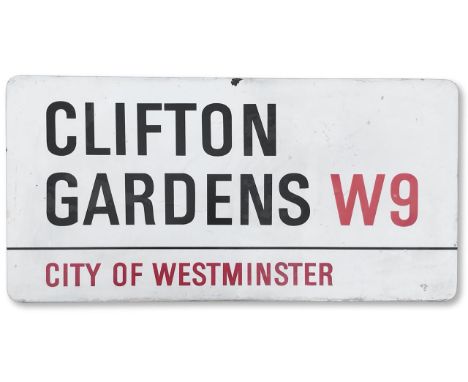 An enamelled iron street sign for Clifton Gardens W9, City of Westminster, with iconic and black and red sans serif lettering
