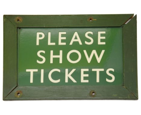 A BR(S) enamel sign displaying 'PLEASE SHOW TICKETS',with white lettering on a green ground, encased in a painted wood frameh