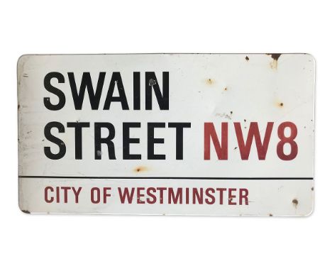 An enamelled iron street sign for Swain Street NW8, City of Westminster with iconic black and red sans serif lettering first 