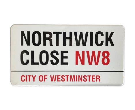 An enamelled iron street sign for Northwick Close NW8, City of Westminster with iconic black and red sans serif lettering fir