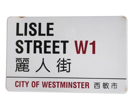 An enamelled iron street sign for Lisle Street W1 Chinatown, City of Westminster with iconic black and red sans serif letteri